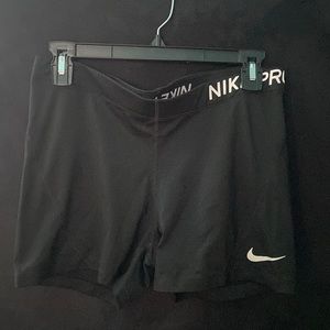 Plain black Nike pros